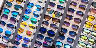Why is it essential to own a pair of sunglasses?